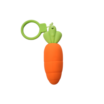 Carrot-shaped bullet vibrator with a green top on a white background