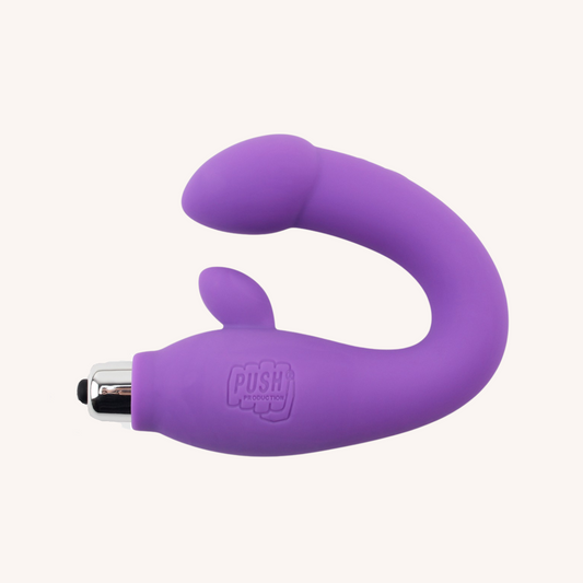 Purple silicone dual vibrator on a white background